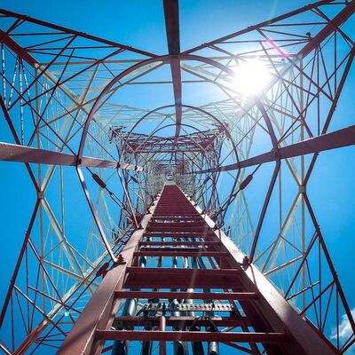 4 Legged Angular Steel Tower designed to meet ANSI TIA and EN standards offering support for telecom and power infrastructure projects